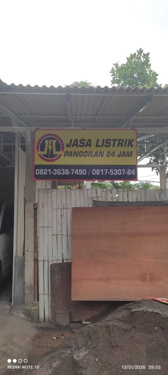 Papan nama JiL Jogja Instalasi Listrik di lokasi usaha